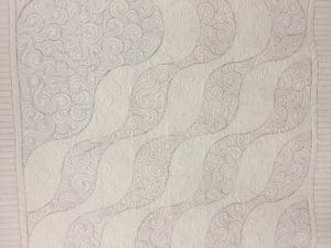 A close up of the fabric for a mattress.