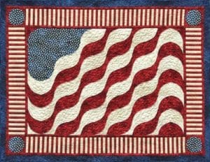 A quilt with an american flag design on it.