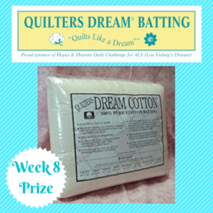 A white pillow sitting on top of a bed.