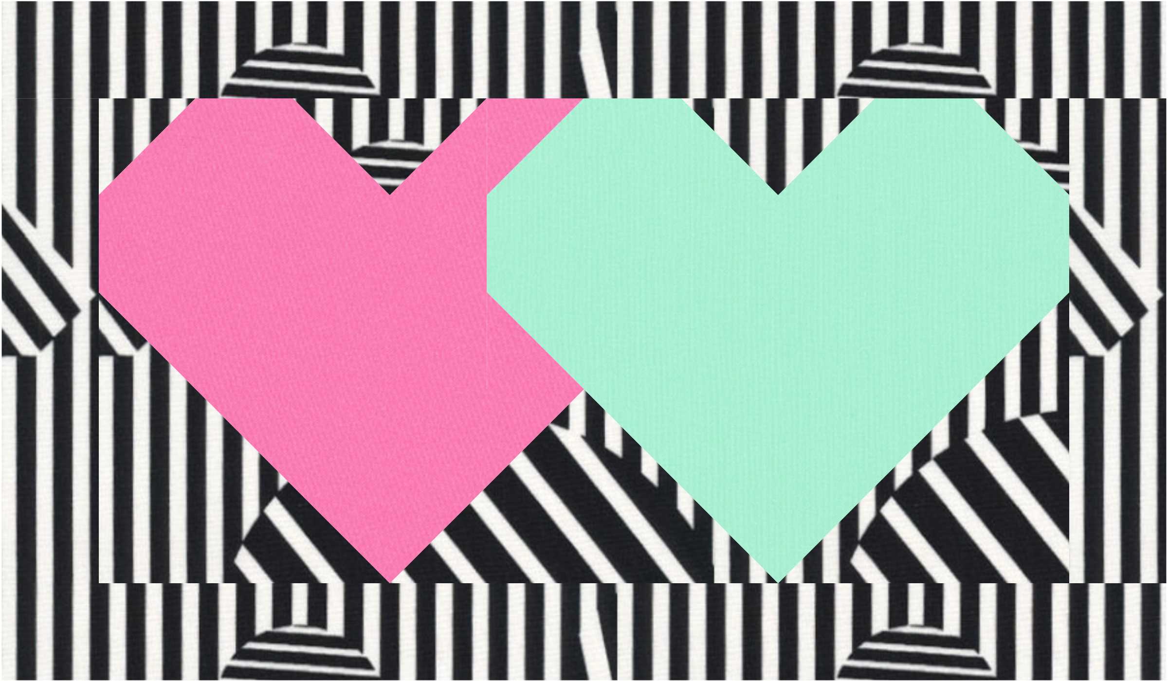 A pink and blue heart on top of black and white stripes.