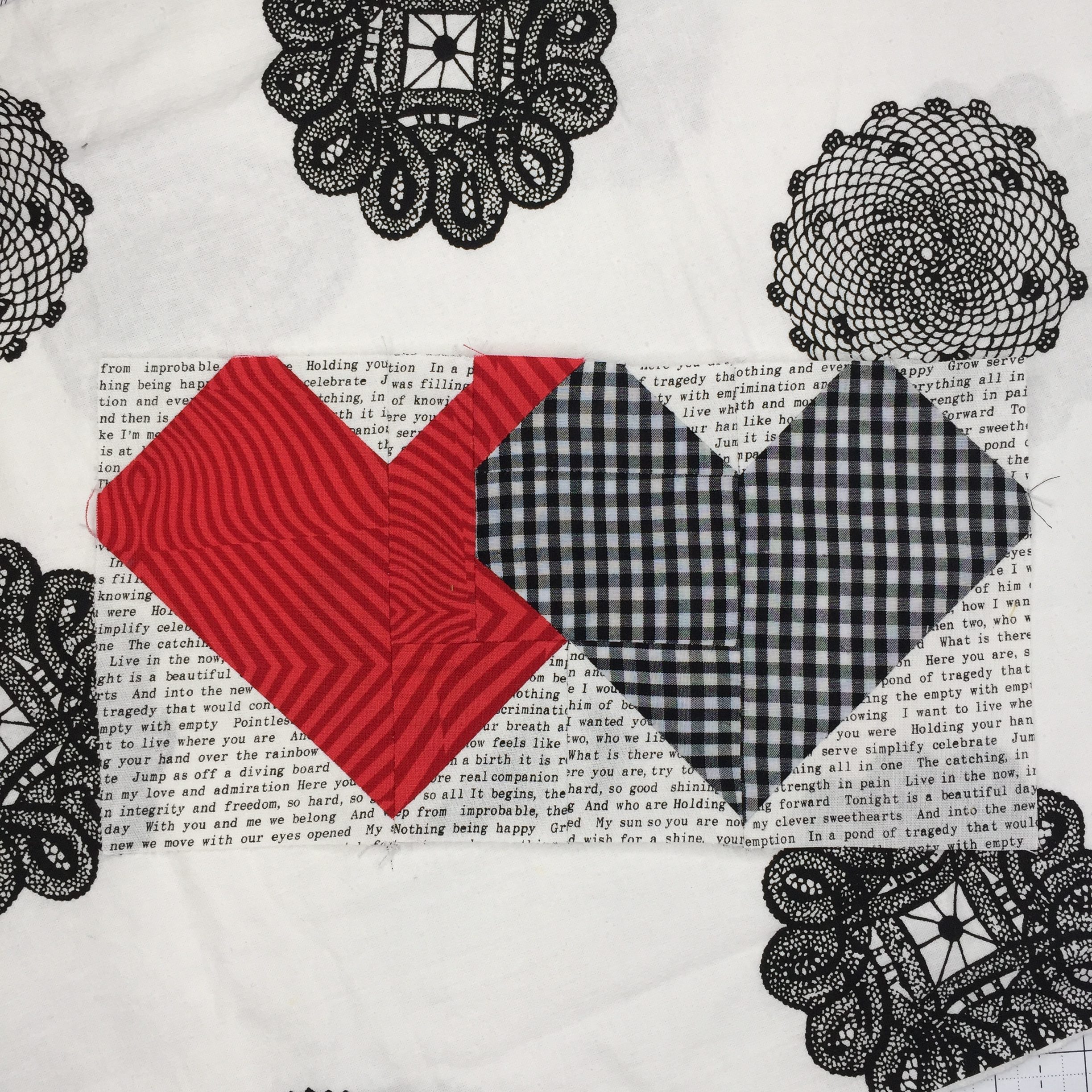 A close up of two hearts on a quilt