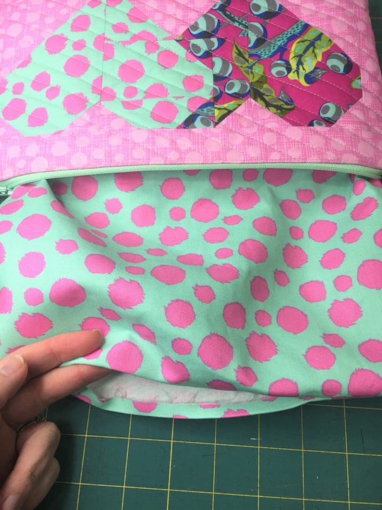 A pink and blue heart on top of black and white stripes.