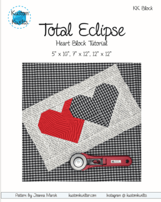 A black and white picture of a heart quilt.