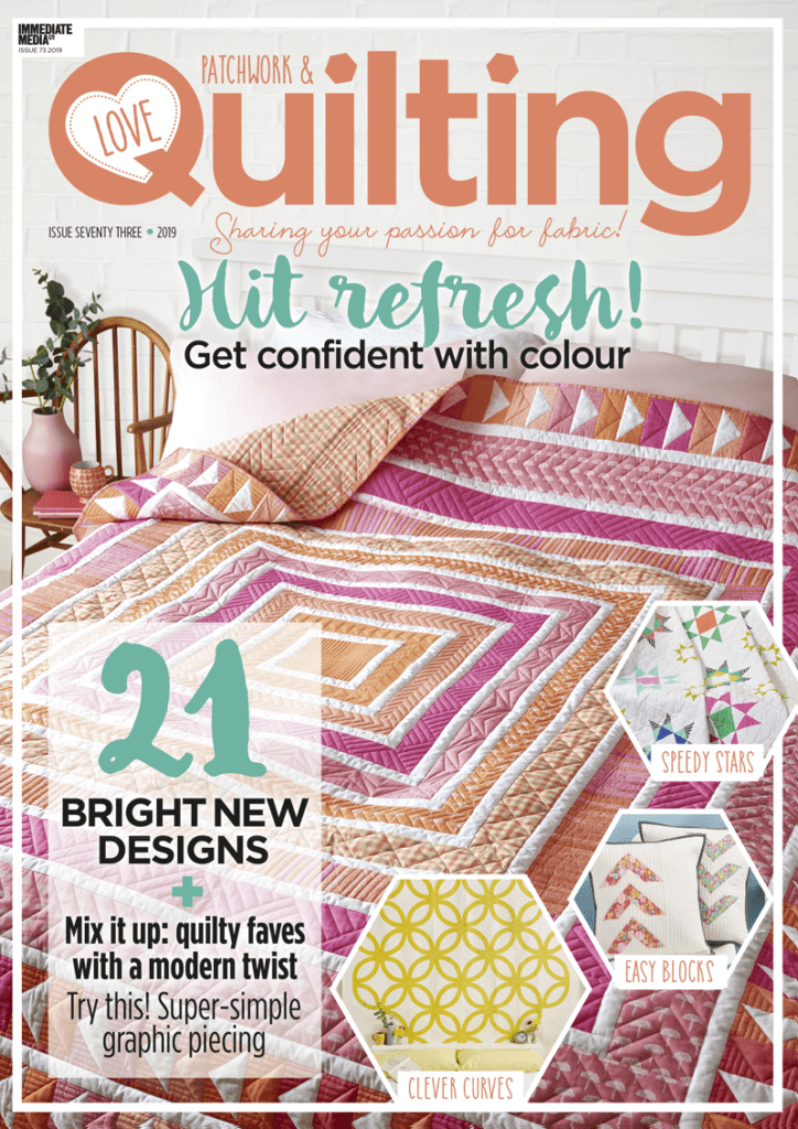 A magazine cover with a quilt on it.