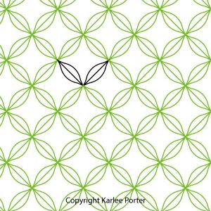 A pattern of green circles with one black circle.