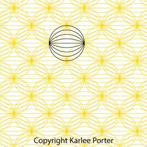 A yellow and white pattern with a black circle in the center.