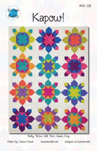 A quilt with different colored stars on it.