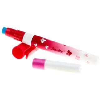 A red and white pen with a blue marker on it.