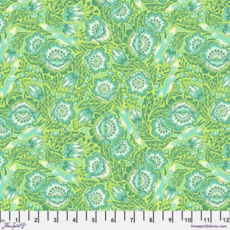 A green floral pattern is shown on fabric.