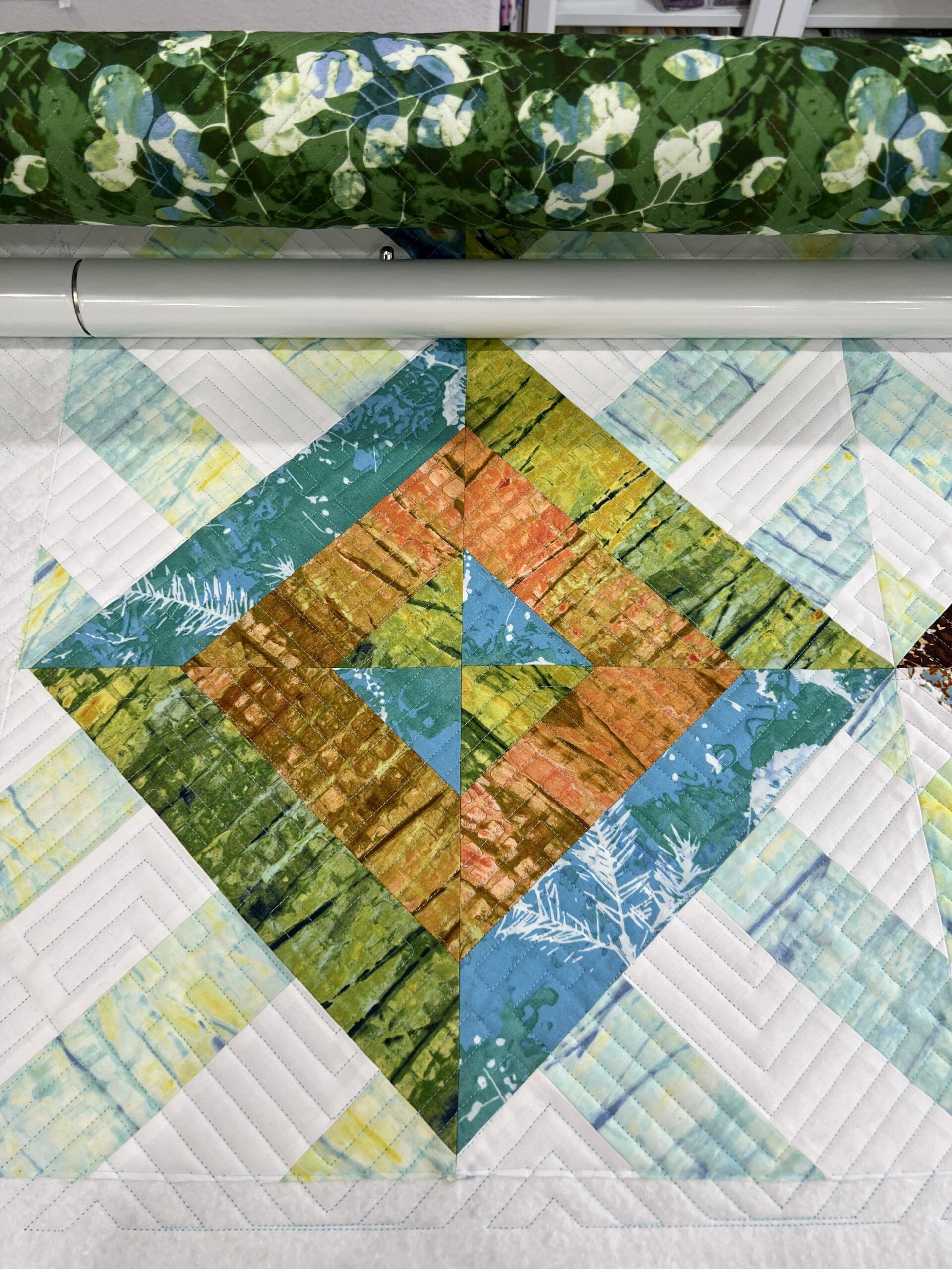 A close up of the top part of a quilt