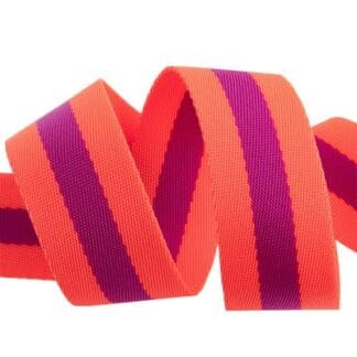 A close up of the ribbon for a red and purple striped ribbon