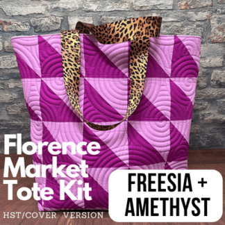 A purple tote bag with leopard print handles.