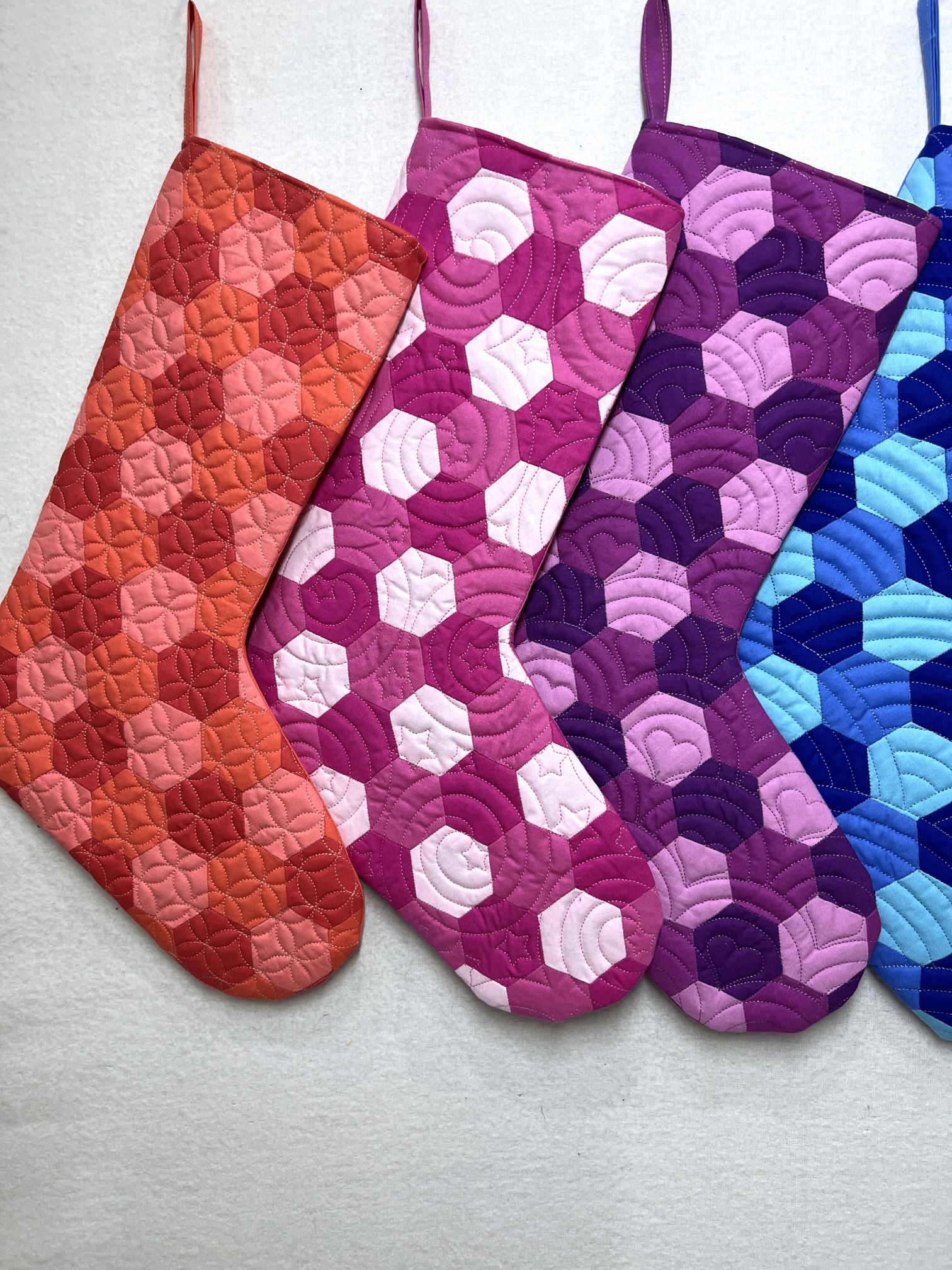 A group of four pairs of socks in different colors.