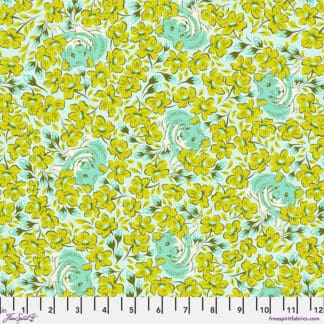A green and yellow floral pattern on fabric.