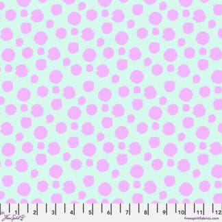 A pink and white polka dot pattern on fabric.